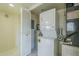 Laundry area features a stacked washer and dryer, water heater, and storage at 839 S Westwood -- # 170, Mesa, AZ 85210