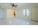 The open living area boasts tile floors, a ceiling fan, and seamless kitchen access at 839 S Westwood -- # 170, Mesa, AZ 85210
