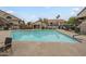 Large community pool surrounded by lounge chairs and landscaping in a well-maintained apartment complex at 839 S Westwood -- # 170, Mesa, AZ 85210