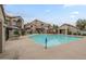 Large community pool surrounded by lounge chairs and landscaping in a well-maintained apartment complex at 839 S Westwood -- # 170, Mesa, AZ 85210