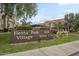 Fiesta Park Village sign with 839 units number at community entrance amid well-maintained landscaping at 839 S Westwood -- # 170, Mesa, AZ 85210