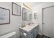 Bathroom featuring a modern vanity with framed art and a toilet at 9013 E Shooting Star Dr, Gold Canyon, AZ 85118