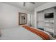 This bedroom has a ceiling fan, closet, and a view into another room at 9013 E Shooting Star Dr, Gold Canyon, AZ 85118