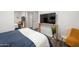 Bedroom featuring a mirrored wall, TV, and cozy seating area at 9013 E Shooting Star Dr, Gold Canyon, AZ 85118