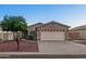 Charming single-story home with a well-maintained front yard and two-car garage at 9013 E Shooting Star Dr, Gold Canyon, AZ 85118