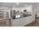 Charming kitchen with stainless steel appliances, dark counters, white cabinets and access to backyard pool at 9013 E Shooting Star Dr, Gold Canyon, AZ 85118