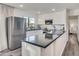 Modern kitchen featuring stainless steel appliances, white cabinets, dark counters, and ample natural light at 9013 E Shooting Star Dr, Gold Canyon, AZ 85118