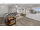 Open-concept living area featuring new laminate flooring, a comfortable gray sofa, and abundant natural light at 9013 E Shooting Star Dr, Gold Canyon, AZ 85118