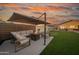 Outdoor patio with comfortable seating, a fire pit, and a putting green offers the perfect entertaining space at 9013 E Shooting Star Dr, Gold Canyon, AZ 85118