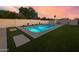 Enjoy this refreshing pool surrounded by green turf and tasteful landscaping, creating a private outdoor oasis at 9013 E Shooting Star Dr, Gold Canyon, AZ 85118