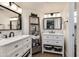 Bright bathroom showcasing dual sinks, modern fixtures, and a decorative storage ladder at 9121 W Topeka Dr, Peoria, AZ 85382