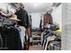 Walk-in closet with ample storage, metal shelving, and rods for hanging clothes at 9221 N Camino Vista Ln, Phoenix, AZ 85028
