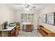 Comfortable home office space with lots of natural light, custom rugs, and desk at 9221 N Camino Vista Ln, Phoenix, AZ 85028