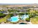 Aerial view of the community pool and recreation center with Gathering-friendly amenities and landscaping at 16683 S 180Th Dr, Goodyear, AZ 85338