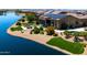 Stunning home with solar panels, pool, and outdoor living area on a lake at 16683 S 180Th Dr, Goodyear, AZ 85338