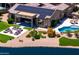 A perfect aerial view of the backyard showcasing the pool and lounging areas by the water at 16683 S 180Th Dr, Goodyear, AZ 85338