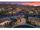 Stunning aerial view of a luxurious home with a lake, pool, and beautifully landscaped yard at 16683 S 180Th Dr, Goodyear, AZ 85338