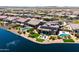 Aerial view of the neighborhood with lakefront properties, lush landscaping, and community pools at 16683 S 180Th Dr, Goodyear, AZ 85338