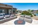Stylish outdoor seating area with firepit and views of the pond, perfect for enjoying the outdoors at 16683 S 180Th Dr, Goodyear, AZ 85338
