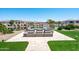 Backyard view of pond and outdoor seating offering peaceful retreat and relaxing views of nature at 16683 S 180Th Dr, Goodyear, AZ 85338