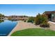 Enjoy backyard views of the lake, lush landscaping, and community surroundings at 16683 S 180Th Dr, Goodyear, AZ 85338
