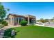 Expansive backyard showcases a well manicured lawn and stylish patio area at 16683 S 180Th Dr, Goodyear, AZ 85338