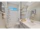 Bathroom showcasing vanity sink and bath shower combination at 16683 S 180Th Dr, Goodyear, AZ 85338