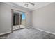 Empty bedroom with sliding glass door leading to the patio at 16683 S 180Th Dr, Goodyear, AZ 85338