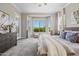 Bright bedroom featuring a large bay window, comfortable bed, and neutral decor at 16683 S 180Th Dr, Goodyear, AZ 85338