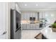 Modern kitchen with stainless steel appliances, sleek cabinetry, and ample counter space at 16683 S 180Th Dr, Goodyear, AZ 85338