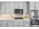 Contemporary kitchen featuring modern appliances, granite countertops, and sleek design at 16683 S 180Th Dr, Goodyear, AZ 85338
