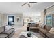 Cozy living room with comfortable seating, connecting to the kitchen and other living areas at 16683 S 180Th Dr, Goodyear, AZ 85338