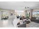 Spacious living room with open layout, modern finishes, and seamless flow to other areas at 16683 S 180Th Dr, Goodyear, AZ 85338