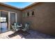 Relax on the cozy patio with dining table and garden views at 16683 S 180Th Dr, Goodyear, AZ 85338