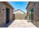 Private outdoor patio with brick floors and cozy string lighting at 16683 S 180Th Dr, Goodyear, AZ 85338