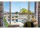 View from the dining room shows a pond with landscaping and neighborhood street at 16683 S 180Th Dr, Goodyear, AZ 85338