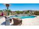 Outdoor seating and heated pool perfect for relaxation and entertainment in a backyard oasis at 16683 S 180Th Dr, Goodyear, AZ 85338