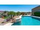 A private swimming pool surrounded by lush landscaping offers a tranquil oasis for relaxation and recreation at 16683 S 180Th Dr, Goodyear, AZ 85338