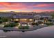 Beautiful single-story home with desert landscaping, pool, and outdoor living space on water at 16683 S 180Th Dr, Goodyear, AZ 85338
