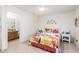 Bright bedroom features bright decor, adjacent to a private bathroom, tile floors and a well-lit window at 2245 Leisure World --, Mesa, AZ 85206
