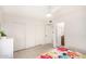 This bedroom features a large closet, access to a bathroom, and tile flooring at 2245 Leisure World --, Mesa, AZ 85206