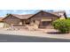 Charming single-story home with desert landscaping and a two-car garage, offering a unique living experience at 2245 Leisure World --, Mesa, AZ 85206