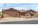 Charming single-story home with desert landscaping and a two-car garage, reflecting a relaxed atmosphere at 2245 Leisure World --, Mesa, AZ 85206