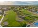 Scenic aerial view of the golf course with sand traps and lush green fairways in this vibrant community at 2245 Leisure World --, Mesa, AZ 85206