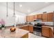 Bright kitchen with stainless steel appliances, granite countertops, and white walls, perfect for cooking at 2245 Leisure World --, Mesa, AZ 85206