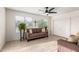 Bright living room features a cozy sofa, neutral décor, and windows that create an inviting atmosphere at , Mesa, AZ 85206