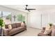 Bright living room features a cozy sofa, neutral decor, and windows that create an inviting atmosphere at 2245 Leisure World --, Mesa, AZ 85206