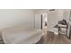 Large bedroom with wood-look floors, and an open door leading to another room at 1006 E Osborn Rd # B, Phoenix, AZ 85014