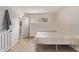 Bright bedroom with wood-look floors, a closet, and natural light at 1006 E Osborn Rd # B, Phoenix, AZ 85014