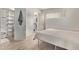 Bright bedroom with wood-look floors, and an open door to a shelved closet at 1006 E Osborn Rd # B, Phoenix, AZ 85014